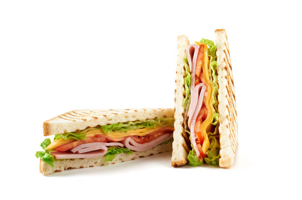 istock Sandwich with ham, cheese, tomatoes, lettuce, and toasted bread. Isolated on white background. 921500980