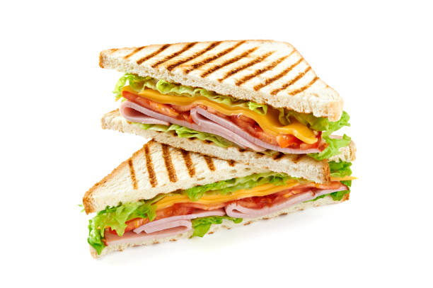 istock Sandwich with ham, cheese, tomatoes, lettuce, and toasted bread. Isolated on white background. 921500984