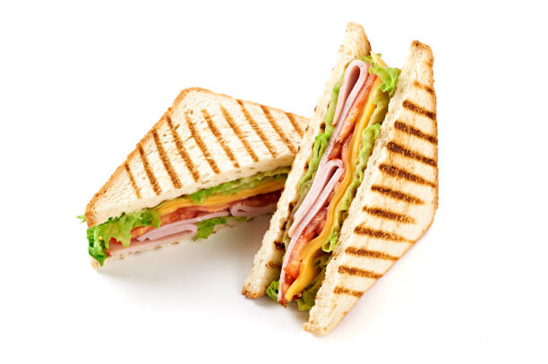 istock Sandwich with ham, cheese, tomatoes, lettuce, and toasted bread. Isolated on white background. 921500986