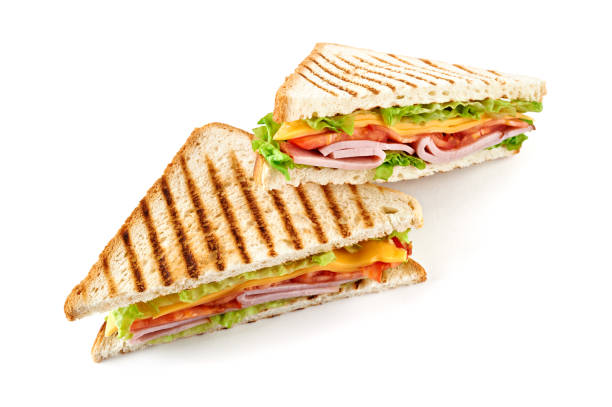 istock Sandwich with ham, cheese, tomatoes, lettuce, and toasted bread. Isolated on white background. 921500988