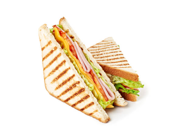istock Sandwich with ham, cheese, tomatoes, lettuce, and toasted bread. Isolated on white background. 921500992