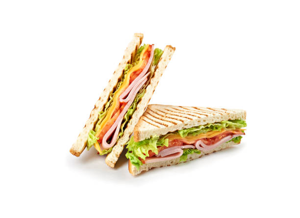 istock Sandwich with ham, cheese, tomatoes, lettuce, and toasted bread. Isolated on white background. 921500994