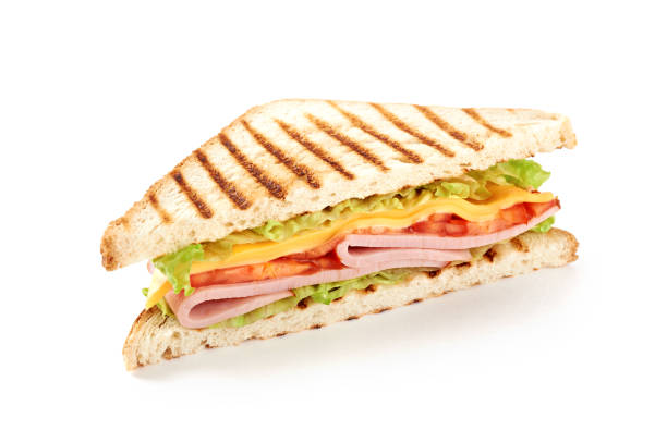 istock Sandwich with ham, cheese, tomatoes, lettuce, and toasted bread. Isolated on white background. 921500998