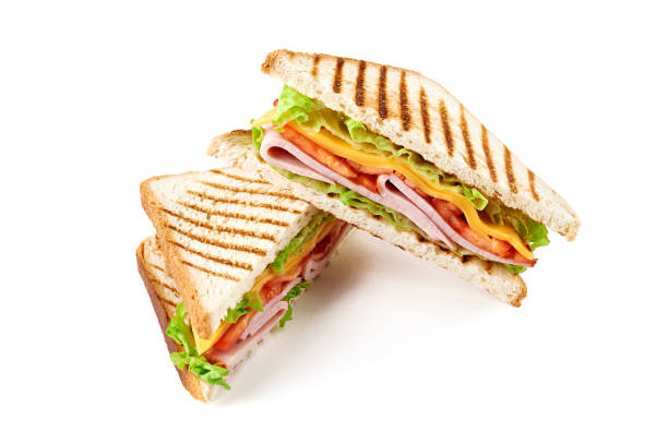 istock Sandwich with ham, cheese, tomatoes, lettuce, and toasted bread. Isolated on white background. 921501004