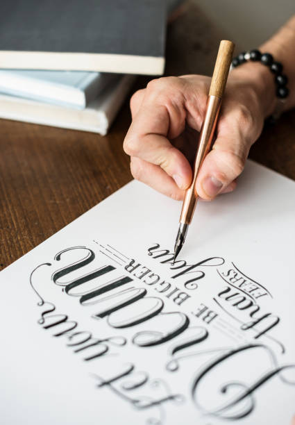 istock Closeup of a calligrapher working on a project 921501360