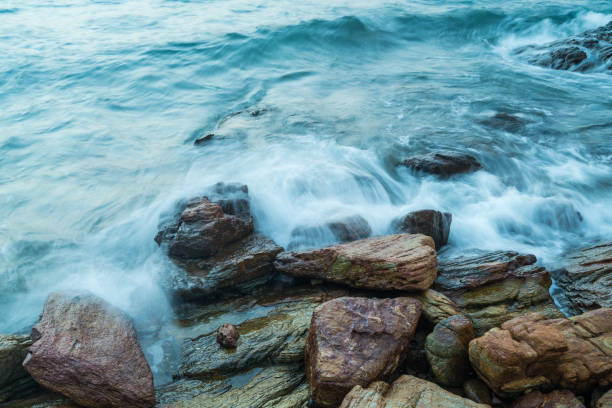 istock Wave in sea hitting rock on coast 921501520