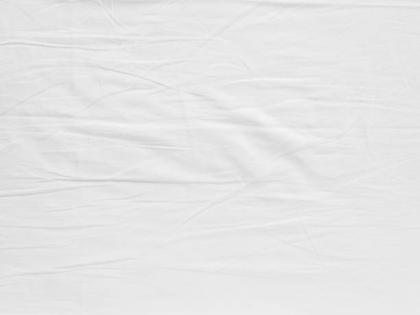 istock White fabic texture wrinkled texture ,Soft focus white fabic crumpled background 921503798
