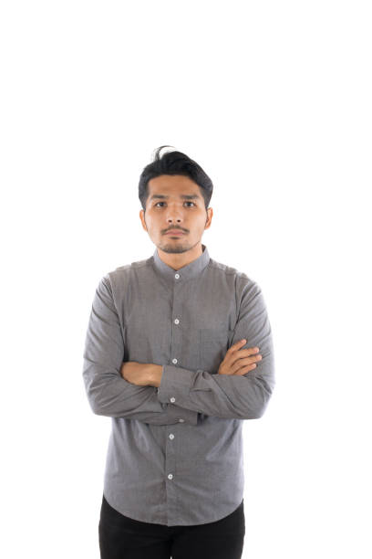 istock Handsome asian young hipster man standing at studio isolated on white background. 921506522