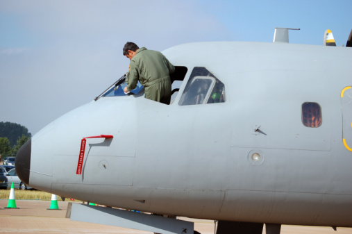 pilot cleaning his aircraft windows.