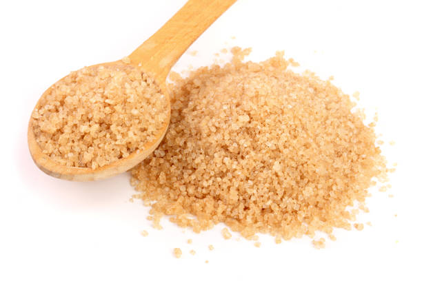 istock brown sugar in wooden spoon isolated on white background 921516148