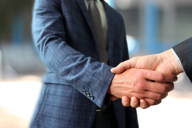istock Successful business people shaking hands  at the meeting 921516228
