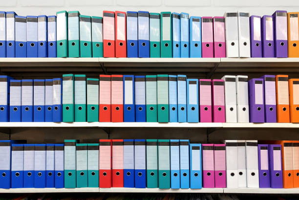 istock colorful ring binder folder on white shelves, office stationary 921516432