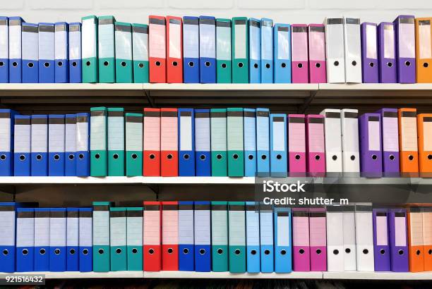 Colorful Ring Binder Folder On White Shelves Office Stationary Stock Photo - Download Image Now
