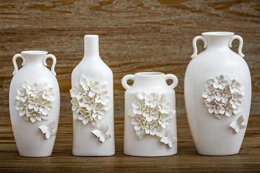 Different decorative white vase with 3d flower and butterfly designs