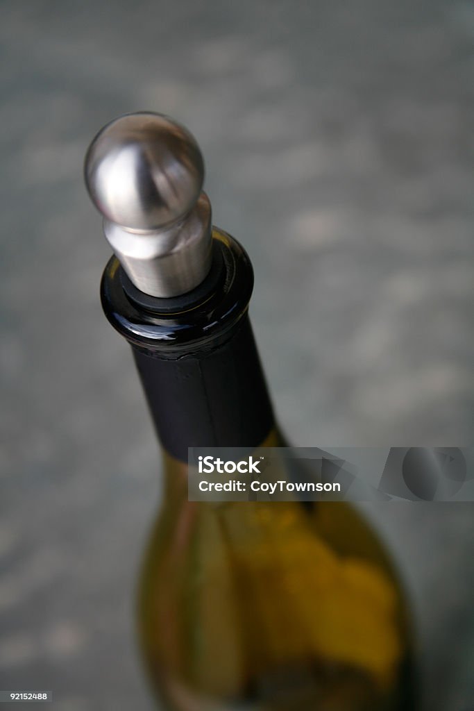 Wine Bottle Close up photograph of a wine bottle with a metalic stopper. Alcohol - Drink Stock Photo