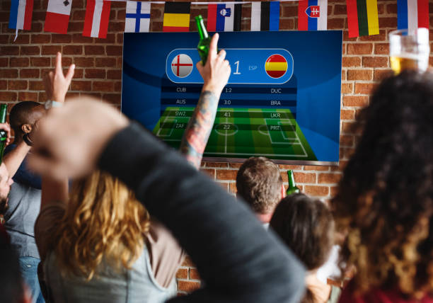 istock Friends cheering sport at bar together 921532420