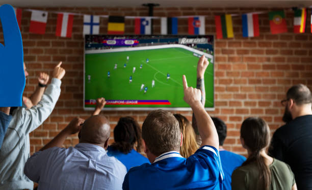 istock Friends cheering sport at bar together 921535244