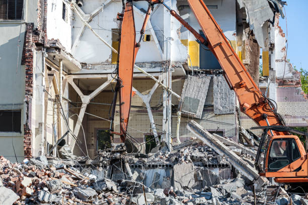 istock dismantling of building with heavy industrial machine 921535642