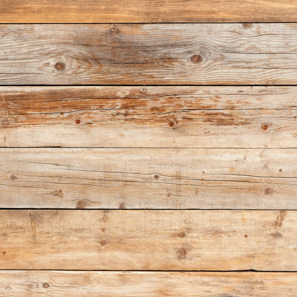 istock Old faded yellow pine natural wood square background texture 921536014