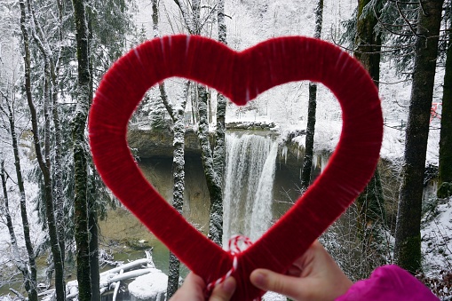 Waterfall Scheidegg which is seen through a heart shape