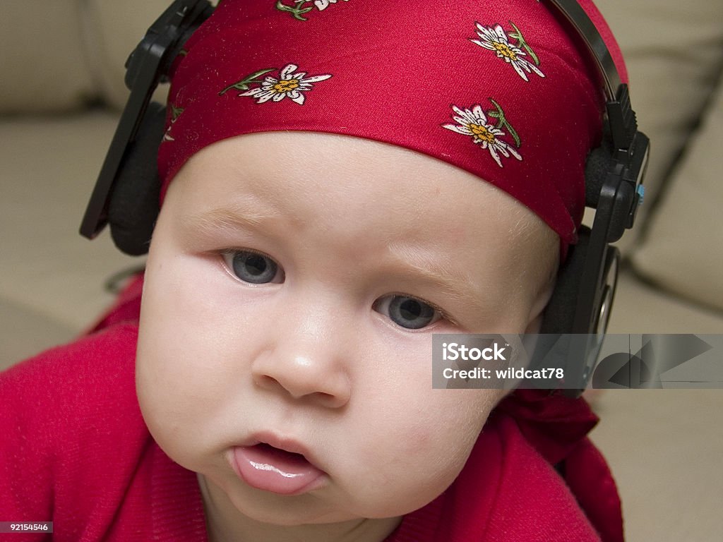 listening to the music  Baby - Human Age Stock Photo