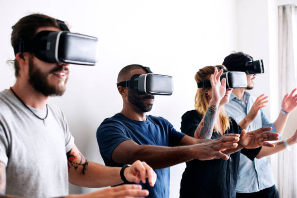 istock Group of diverse friends experiencing virtual reality with VR headset 921556996