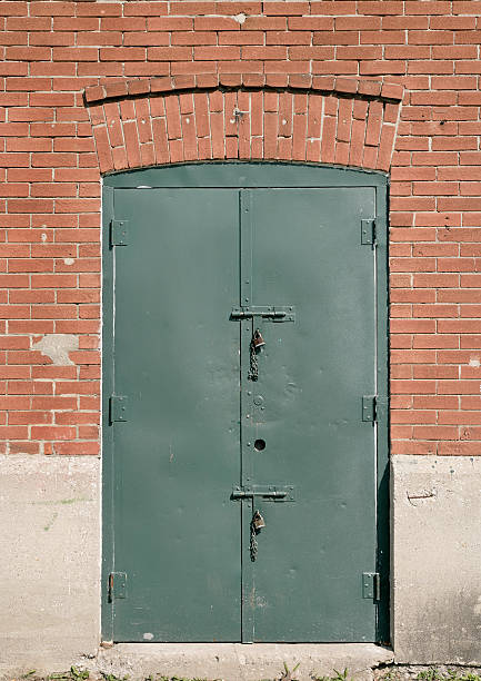 istock Brick wall and green Door 92155967