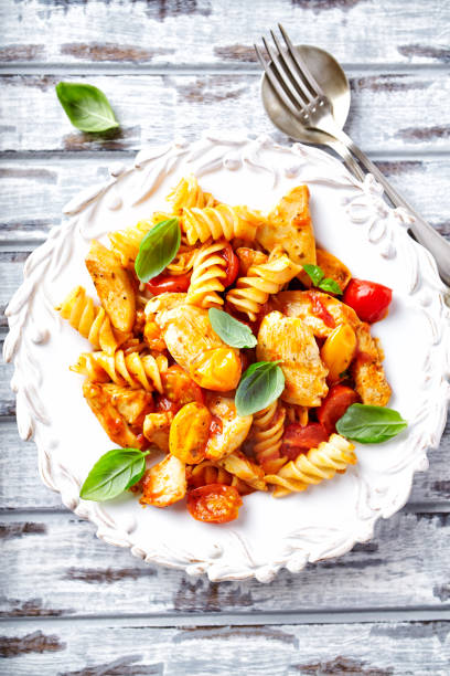 istock Fusilli Pasta with Chicken and Cherry Tomatoes 921559756