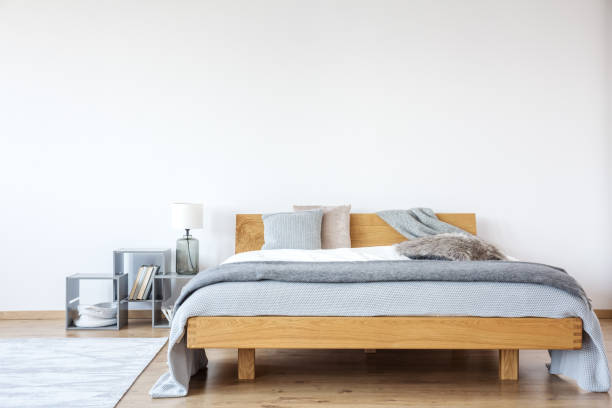 istock Wooden king-size bed in bedroom 921560126