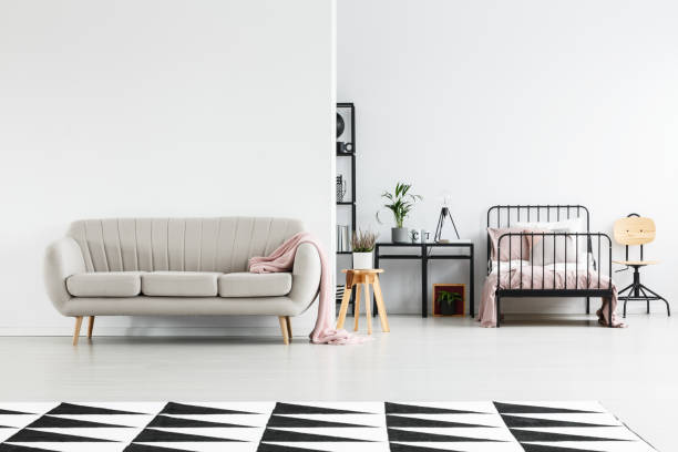 istock Girl's bedroom with beige sofa 921560546