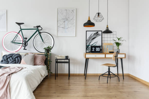 istock Retro desk in stylish bedroom 921560636