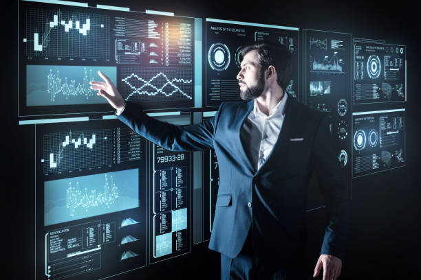istock Smart man standing alone and touching the futuristic screen of his device 921581548