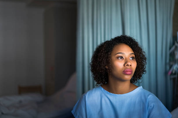 istock Thoughtful young female patient looking away 921582588