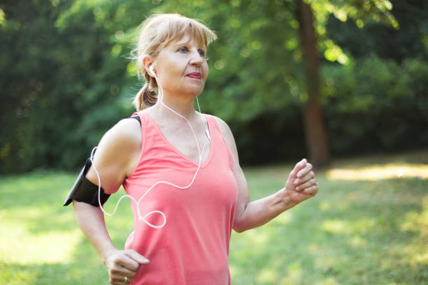 istock Senior woman jogging 921584184