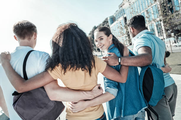 istock Nice happy friends holding on to each other 921584884