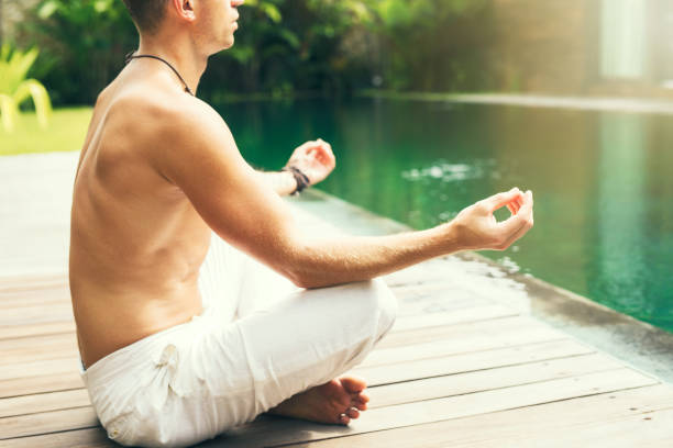istock Man meditate in the morning 921587788