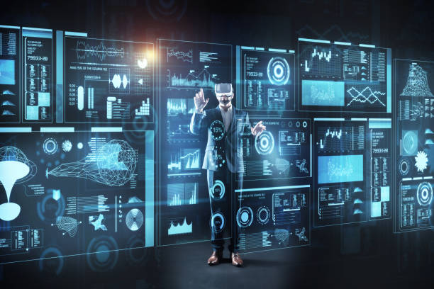 istock Curious programmer standing in front of a screen in virtual reality glasses 921590702