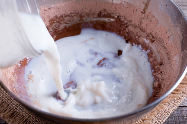 istock Mixing dough for pancakes or cake in bow 921590952