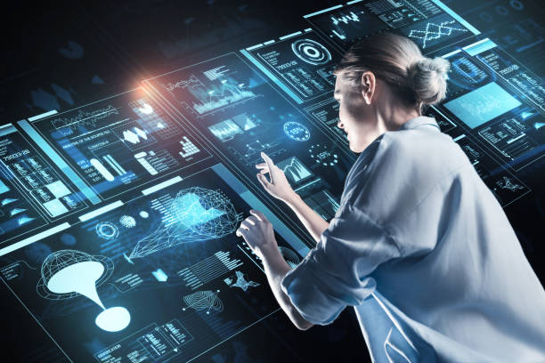 istock Reliable person smiling while looking at the information on the screen 921591090