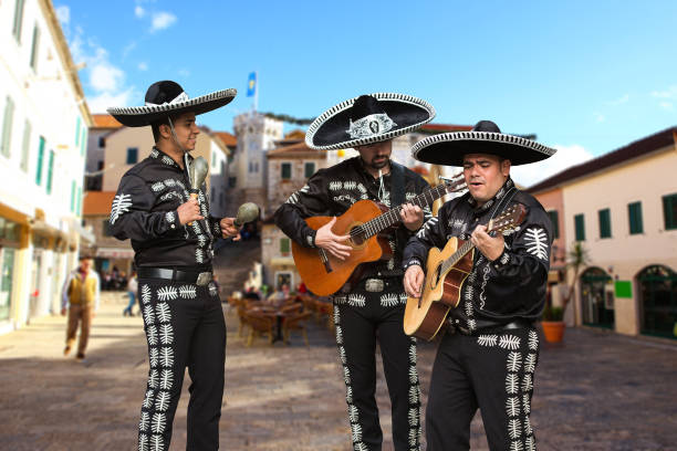 Mexican musicians mariachi Mexican musicians mariachi on a city street mariachi stock pictures, royalty-free photos & images