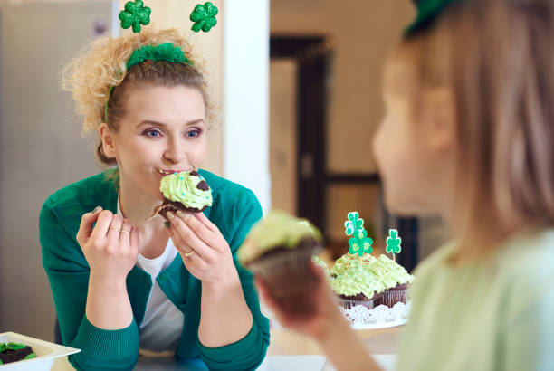 istock Woman eating tasty a cupcake 921593976