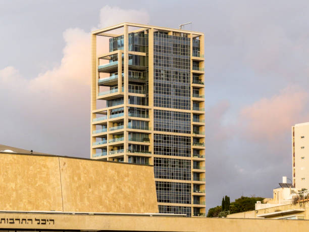 Tel Aviv, Israel - January 2, 2018: view of the skyscraper behind the building of the Charles Bronfman Auditorium
