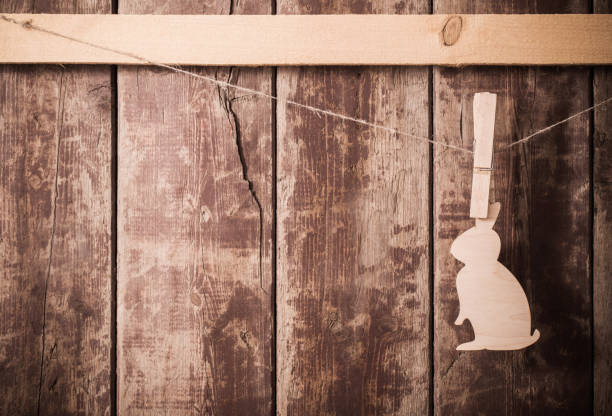 Easter wooden bunny on wooden background