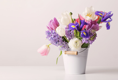 Bouquet of mixed flowers, primarily zinnia  flowers. Isolated on white background.