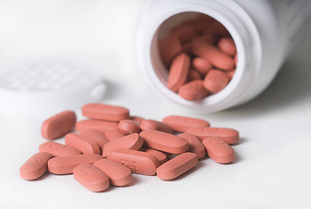 istock spilled pile of red tablets 92159759