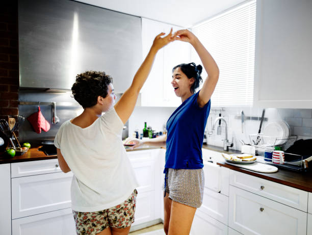 istock Lesbian couple dancing in the kitchen 921601516