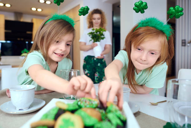istock Portrait of siblings reaching for cookie 921601750
