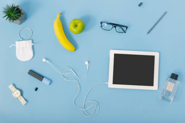 istock Creative education background. Tablet with supplies for education on blue background, top view 921601940