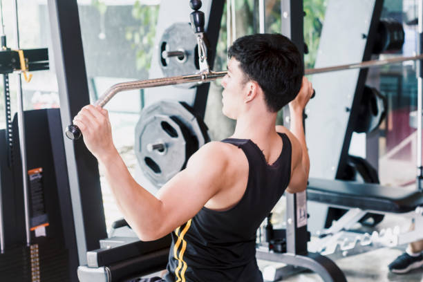 istock Fitness man execute exercise with exercise-machine at the gym 921602196