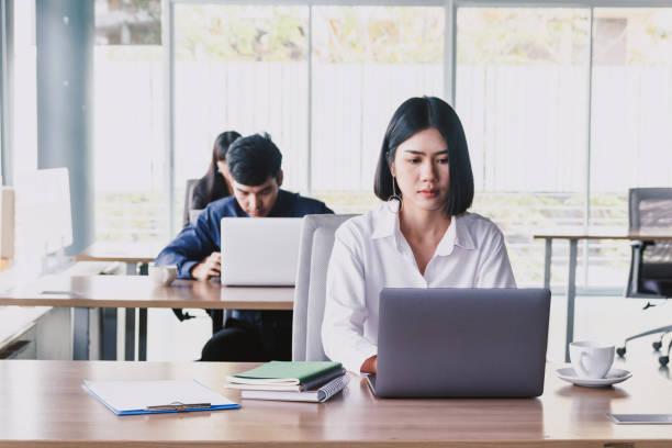 istock Businesswoman working on notebook computer and business document at office 921602220